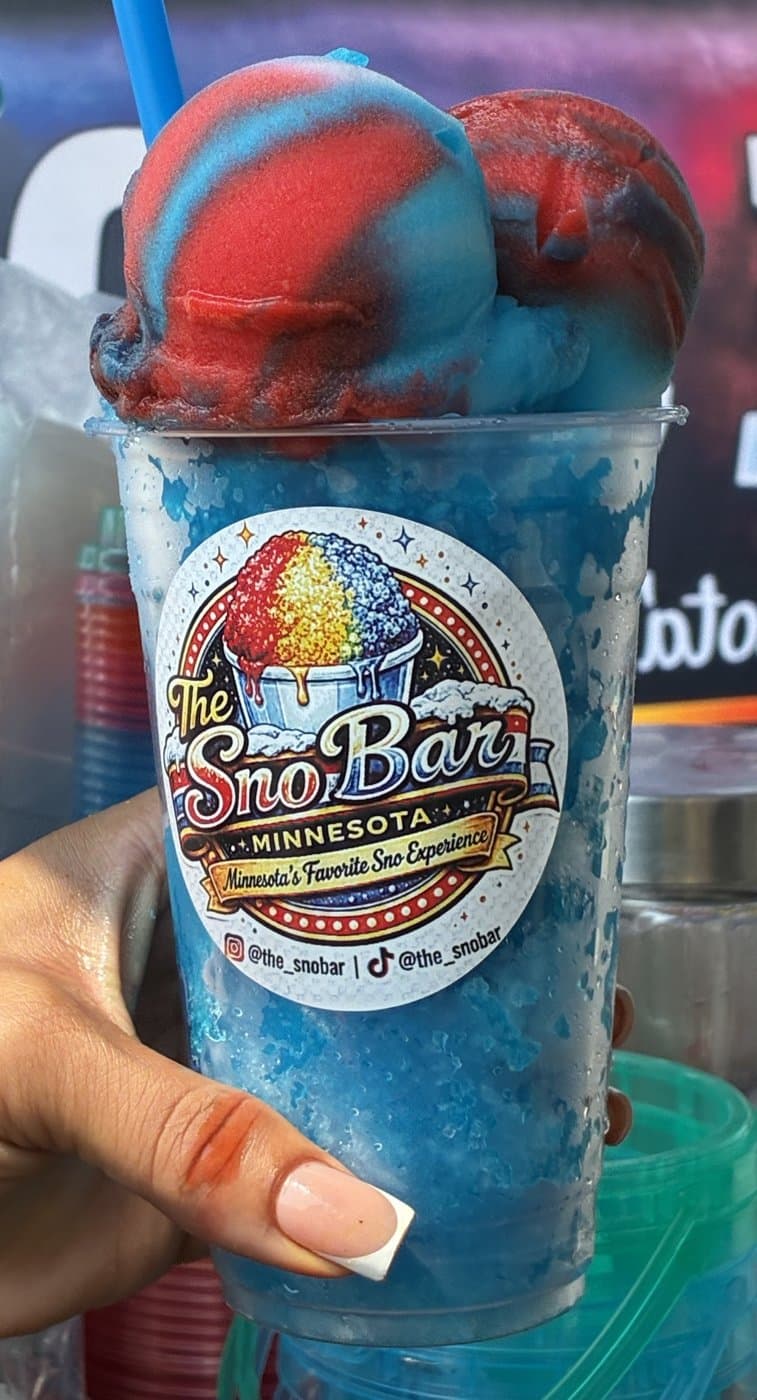 Blue Skies Sno Globe: blue raspberry snoball crowned with red and blue water ice