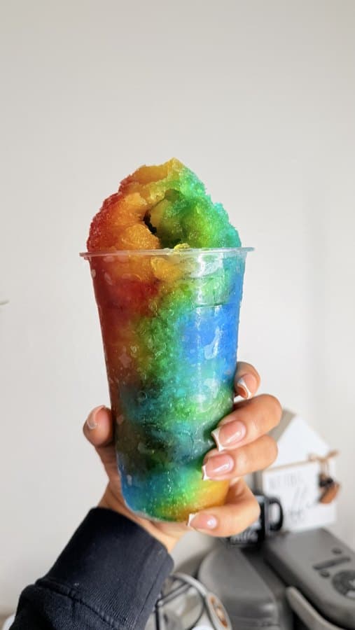 A rainbow snoball from The Sno Bar, piled high above the cup