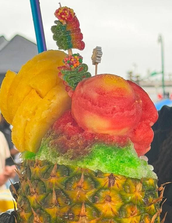 Stuffed pineapple with water ice, fresh pineapple and candy skewers
