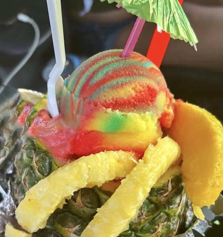 Stuffed pineapple with rainbow water ice and pineapple spears